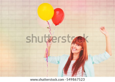 Similar – Young cheerful woman with a gift over her head