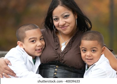 Smiling Hispanic Mother With Two Sons Happy Family