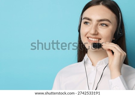 Smiling hotline operator in headset on light blue background. Space for text