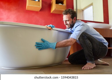 Smiling Houseman Cleans The Bathtub For Emancipation And Role Reversal