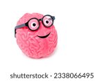 Smiling human brain buddy with googly eyes and nerdy glasses isolated on white background with copy space.