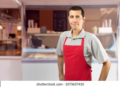 Smiling Ice Cream Car Employee With Apron At Beach