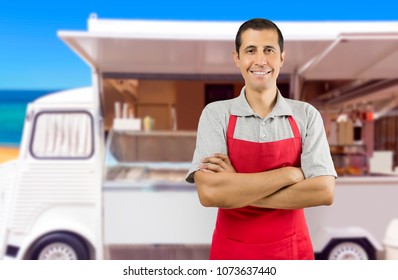 Smiling Ice Cream Car Employee With Apron At Beach