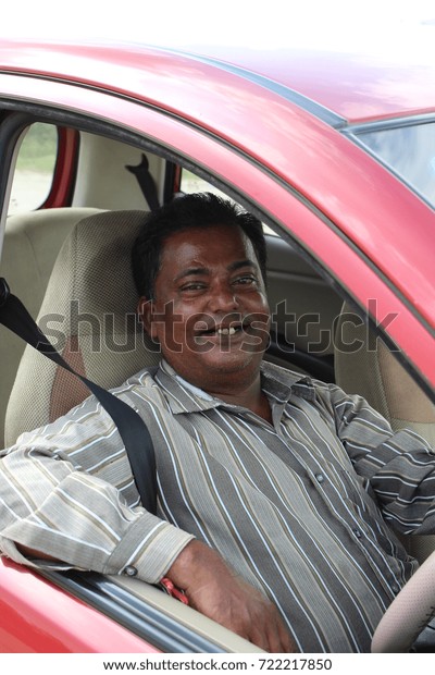Smiling Indian car\
driver