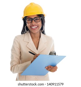 Smiling Indian Female Construction Engineer With Safety Helmet Smiling Happy Writing Report. Portrait Of Beautiful Asian Female Model Standing Isolated On White Background.