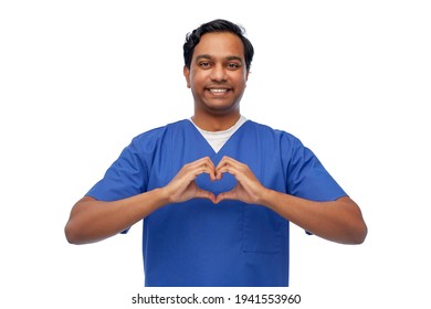 smiling indian male doctor showing hand heart