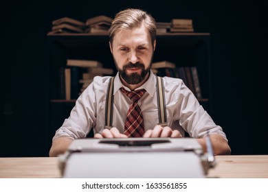 Smiling Inspired Novelist Typing In Shaded Study