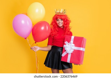 Smiling Kid In Crown With Present Box And Party Balloon On Yellow Background