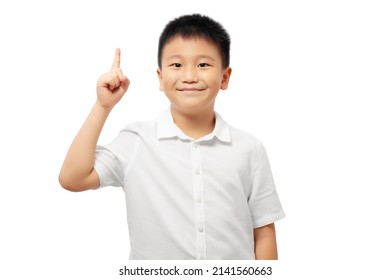 Smiling Kid With Finger Pointing Up, Number One, Wearing White Shirt Isolated On White Background