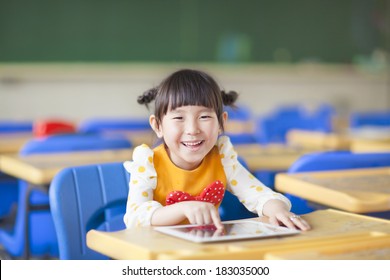 smiling kid using tablet  or ipad