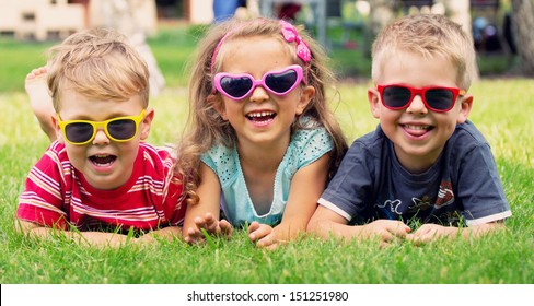 Smiling kids at the garden - Powered by Shutterstock