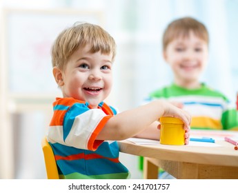 Smiling Kids Painting At Home Or Day Care Center