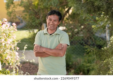 Smiling Latino man outside his house in rural area - Happy Mayan senior - Hispanic proud of his roots - Powered by Shutterstock