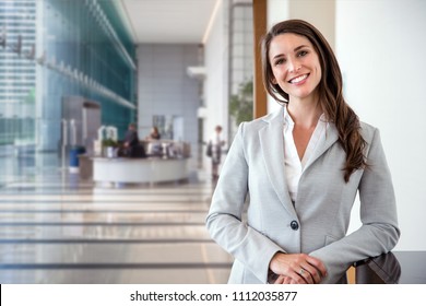 Smiling Likable Sincere And Charming Business Woman Financial Executive Type Portrait Inside Commercial Building