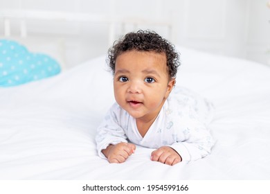 Smiling Little African American Baby In A Crib, Portrait