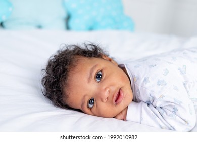 Smiling Little African American Baby In A Crib, Portrait