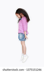 Smiling Little Asian Child Girl Freedom Movement Over White Background. Kid Activity Concept.