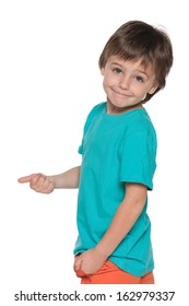 A smiling little boy in blue shirt holds his thumb up and back on the white background