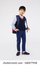 Smiling Little Boy In School Uniform With Big Backpack