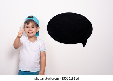 Smiling little boy showing thumbs up.  Blank text bubble. Available Copy Space for ad text.  - Powered by Shutterstock