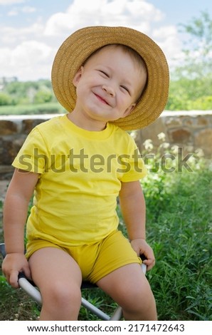 Similar – small girl wearing a hat singing happily