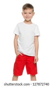 A smiling little boy in white shirt; isolated on the white background