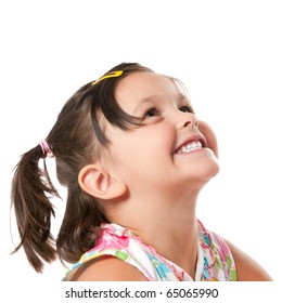 Smiling Little Child Looking Up At Copyspace Isolated On White Background