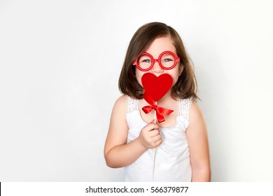 smiling little child in toy glasses