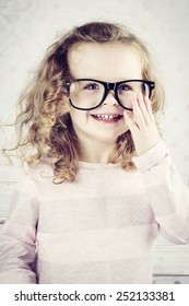 Smiling Little Girl With Glasses