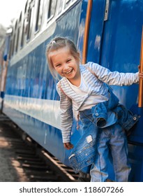 Smiling little girl on train
