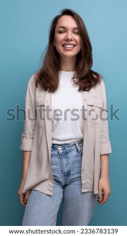 smiling lovely brunette 30 year old female person in shirt and jeans is happy