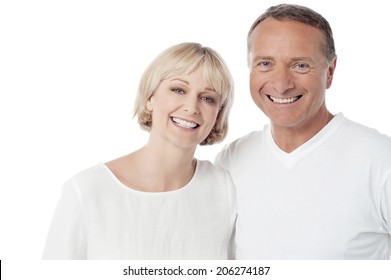 Smiling Loving Couple Standing On White Background