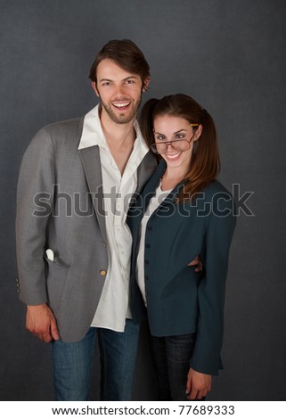 Smiling male and cross-eyed female Caucasian couple.