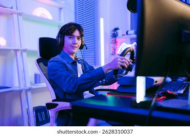 Smiling male gamer in headset and denim shirt plays a racing game using a steering wheel controller in a neon-lit room, showcasing immersive gaming setup, e-sports lifestyle, and digital fun.