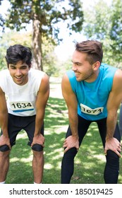 Smiling Male Marathon Runners Talking In Park