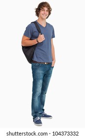 Smiling Male Student With A Backpack Against White Background