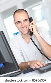 Smiling Man Answering The Phone