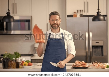 smiling man cook delicacy salmon. man cook delicacy salmon fish. man cook delicacy salmon