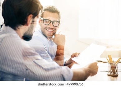 Smiling Man During Business Meeting With His Partner