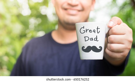 Smiling Man Holding A Cup Of Coffee With Word 