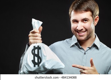 Smiling Man Holding Money Bag And Winking