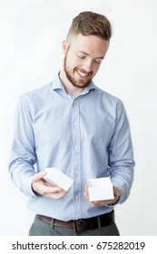 Smiling Man Holding Small Empty Box