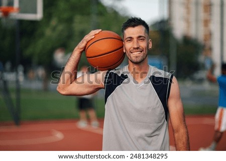 Image, Stock Photo Portrait of positive basketball player training on street court
