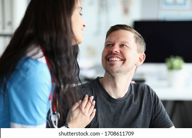 Smiling Man Looks At Doctor Woman With Confidence. Restoration Ability People With Disabilities To Household, Social Activities. Rehabilitation In Clinic. Restore And Adapt To Life After An Accident