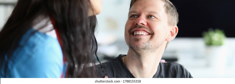 Smiling Man Looks At Doctor Woman With Confidence. Restoration Ability People With Disabilities To Household, Social Activities. Rehabilitation In Clinic. Restore And Adapt To Life After An Accident