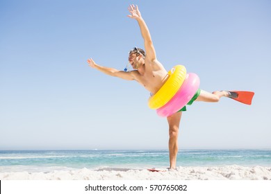 Smiling Man Posing With Rubber Ring On The Beach