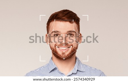 A smiling man is shown in front of a plain background with facial recognition technology overlay. This technology highlights key facial features for identification purposes.