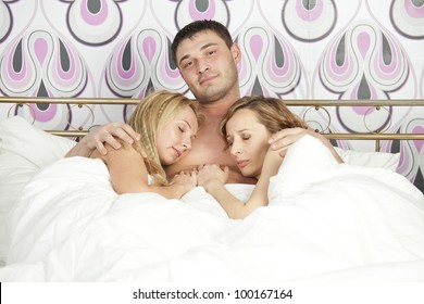 smiling-man-sleeping-two-women-260nw-100167164.jpg