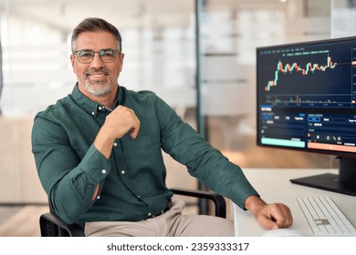 Smiling mature business man crypto broker, financial investor, trader or expert adviser at work, portrait. Digital trade finance exchange market, asset management, stock funds investment analysis. - Powered by Shutterstock