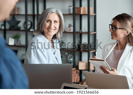 Similar – Image, Stock Photo Young man and woman relaxing in the bar and having drinks. Nightlife and hanging out